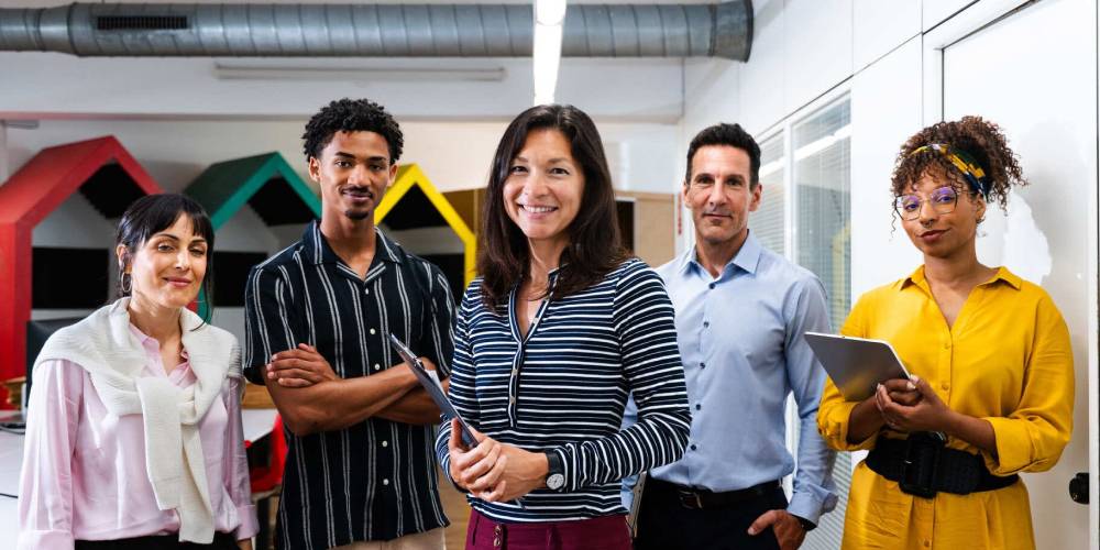 Team collaborating with AI workflow dashboards